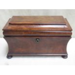 A Regency style 19th century walnut veneered sarcophagus form tea caddy, with two lidded