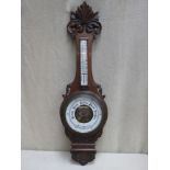 Victorian carved oak cased aneroid banjo barometer, with enamelled skeleton dial and mounted