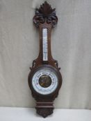 Victorian carved oak cased aneroid banjo barometer, with enamelled skeleton dial and mounted