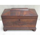 A Regency style 19th century mahogany veneered sarcophagus form tea caddy, with two lidded