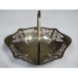 Hallmarked silver fruit / cake basket, with pierce work decoration and swing over handle, by