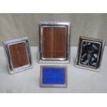 Four various 20th century hallmarked silver free standing photo frames, various makers, assay