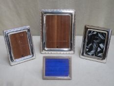 Four various 20th century hallmarked silver free standing photo frames, various makers, assay