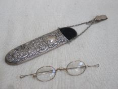 Hallmarked silver repousse decorated spectacle case, plus pair of yellow metal spectacles