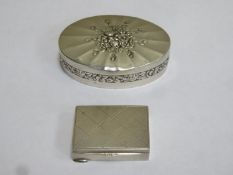 800 silver oval pill box with repousse floral decoration and hinged cover, plus another smaller