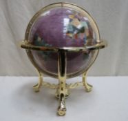 A decorative table top gemstone globe suspended on gilt metal base with integral compass, Approx.