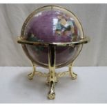 A decorative table top gemstone globe suspended on gilt metal base with integral compass, Approx.