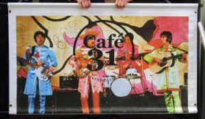 Advertising banner for Cafe 31 Mathew St with Beatles in Sgt. Pepper suits. Approx. 60 x 36
