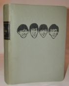 The Beatles Monthly Book manufactured by Easybind Ltd, London. The grey folder has caricature head