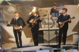 Large photograph of The Beatles on stage at the Ed Sullivan Show