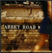 The Beatles Abbey Road back cover photograph by Iain McMillan. Shows a girl in a blue dress