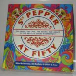 Sgt. Pepper At Fifty signed by author Mike McInnerney and Dudley Edwards who painted Paul