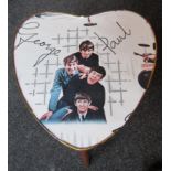 Heart form Beatles Table with Beatles wallpaper under glass. Approx.16 inch high,14 inch width,1964