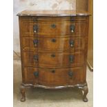 Early 20th century mhaogany and walnut veneered serpentine fronted chest of four drawers, with