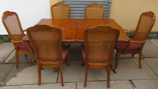 20th century oak effect extending dining table with two leaves, decorated with geometric inlay, plus