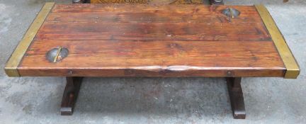 Interesting rustic style brass bound wooden coffee table, formerly a ships hatch door. Approx.