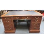 20th century walnut veneered partners desk, on pedestal supports, fitted with ten drawers and two