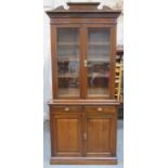 19th century two door glazed bookcase, with two drawers and two cupboard doors below 244cm H x 107cm