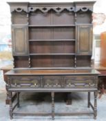 20th century oak welsh style three drawer kitchen dresser with plate rack above. Approx. 195cm H x