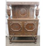 Early 20th century heavily carved oak court cupboard on pineapple supports. Approx. 152 widhigh x