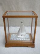 Glazed wooden cased Japanese 985 Hallmarked Silver model of a Yacht by, Seki Takehiko, case