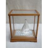 Glazed wooden cased Japanese 985 Hallmarked Silver model of a Yacht by, Seki Takehiko, case