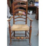 19th century rush seated country style ladder back armchair, on stretchered supports. Approx.