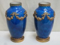 Pair of Victorian glazed cobalt blue coloured ceramic vases, with gilt metal floral and foliate