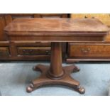 Victorian mahogany fold over games table, on quadrafoil supports, with felt lined interior.