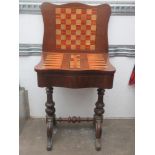 Victorian mahogany serpentine fronted foldover games table, fitted with single drawer and inlaid