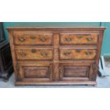 19th century oak chest of four drawers with two cupboard doors below. Approx. 93cm H x 134cm W x
