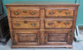 19th century oak chest of four drawers with two cupboard doors below. Approx. 93cm H x 134cm W x