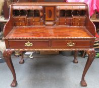 20th century mahogany writing desk, fitted with drawers, pigeon holes and central small cupboard, on