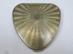 Hallmarked silver machine turned heart form Cherie powder compact, London assay dated 1957 by Kigu