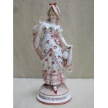 German hand painted and gilded figure depicting a lady in period clothing, stamped KPM to base and