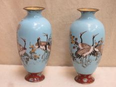 Pair of 19th century Japanese cloisonne vases, decorated with cranes and floral arrangements.