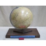 George Phillips 10 inch challenge globe on oak supports with insert containing atlas . Approx.