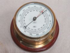 Vintage brass and glass circular wall mounting barometer, stamped KH to face, Approx. 19cms diameter