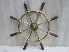 Brass eight-spoke ships wheel with wooden grips by Brown Bros. & Co, Rosebank Ironworks Edinburgh,