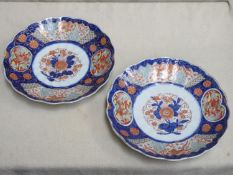 Pair of late 19th/early 20th century oriental wave edged ceramic chargers, decorated with hand