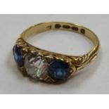 18ct gold ladies dress ring set with central diamond, flanked by two blue sapphires