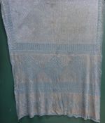 early 20th century blue and silver thread shawl, circa 1930s, with symmetric bands of decoration.