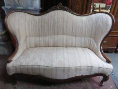 Victorian mahogany framed upholstered double end chaise longue, with carved decoration
