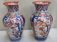 Pair of 19th century Oriental glazed ceramic vases, decorated in the typical Imari palette.