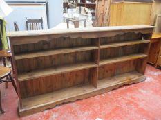 Early 20th century set of stained pine open bookshelves. Approx. 98cm H x 204cm W x 25cm D