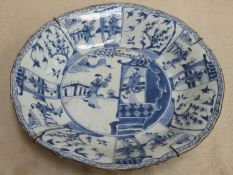 18th /19th century oriental blue and white glazed ceramic waved edged bowl, decorated with panels