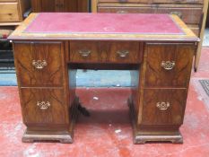 Art Deco walnut veneered five drawer kneehole writing desk, with leather top. Approx. 66cm H x