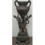 Late 19th/early 20th century bronze effect freestanding urn, decorated with classical female