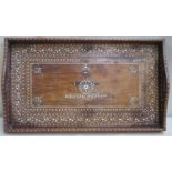 Early 20th century wooden two handled serving tray, heavily inlaid with ivory and depicting the