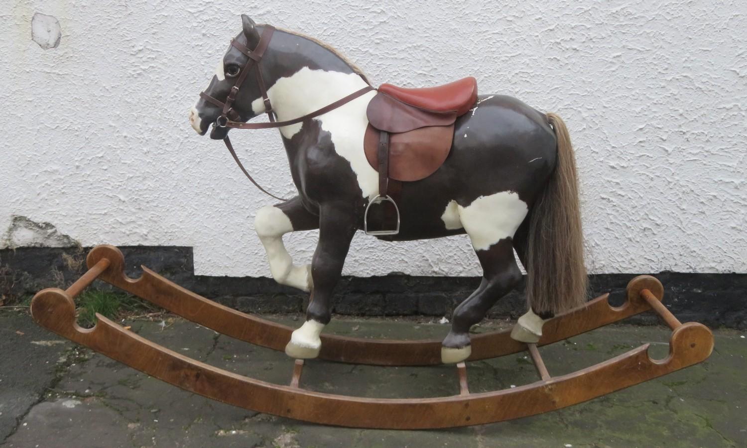 Vintage APES hand decorated child's rocking horse, mounted on wooden stand. Approx. 113cm H x